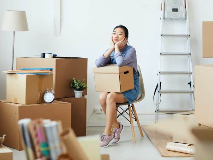 young-asian-woman-waiting-for-moving-crew